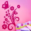 Floral butterfly sticker in a cheerful pink bedroom, adding charm and color to a child\'s nook.
