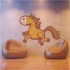 Cheerful horse sticker in warm colors, perfect for a child\'s room or play area.
