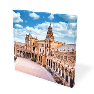 Canvas print from a photo 30x30 cm - Urban setting. Brick building with a cloudy sky.