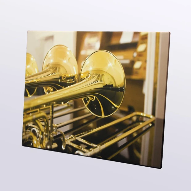 Canvas print from a photo 40x60 cm - Studio music arrangement featuring brass instruments in shades of gold.