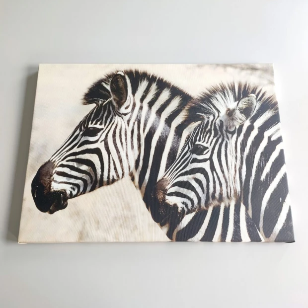 Canvas print 75x100 cm - Graphic design featuring two zebras with distinct black and white stripes.