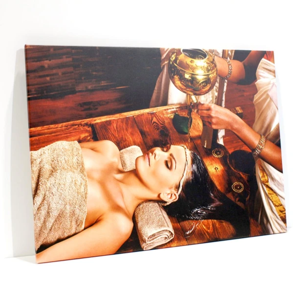 Canvas print 80x120 cm - Spa arrangement. Image shows a person relaxing during a treatment.