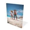 Canvas print from a photo 80x120 cm - Outdoor setting. Family at the beach with sea and sky in the background.