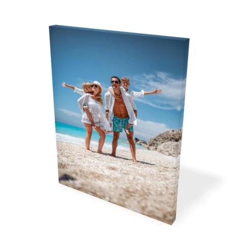 Canvas print from a photo 80x120 cm - Outdoor setting. Family at the beach with sea and sky in the background.