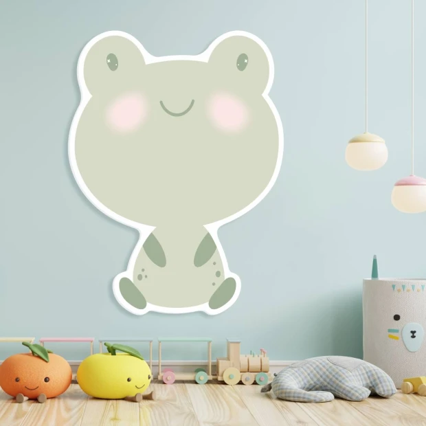 Magnetic dry-erase frog board for kids, styled in a bright children\'s room with light walls and flooring.