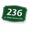 Green house address plaque with number and street name, featuring white digits and letters.