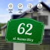 Address plaque with street and house number - Graphic design. Green plaque with white numbers and text, water droplets.