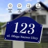 House number sign with street name - Graphic design. Semi-circular shape with a navy background and white numbers.