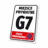 Private area sign, no parking, with number and graphic design. White sign with large black text.