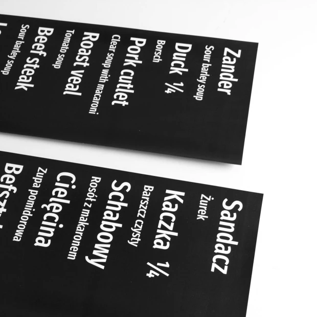 Magnetic dry-erase film with custom print - Graphic design. Black background with white text, various dish names.