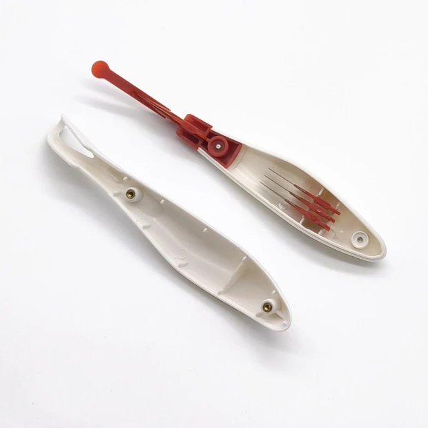 Safe media cutting knife - elongated shape with a handle and concealed blade.