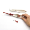 Safe media cutting knife - Graphic design. Knife with a white body, red accents, and a replaceable blade.