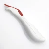 Safe media cutting knife - Graphic design. Ergonomic shape, white color with red accents.