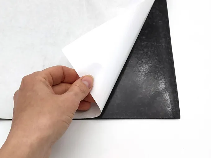 Self-adhesive magnetic strip by the meter, 100 cm wide - Graphic design. White part with protective paper, black part smooth.