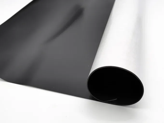 Self-adhesive magnetic strip by the meter, 100 cm wide - Graphic design. Black background with white paper roll.