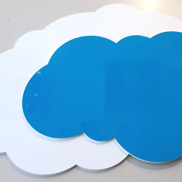 Dry-erase magnetic board for kids\' room, cloud shape in blue with graphic design.