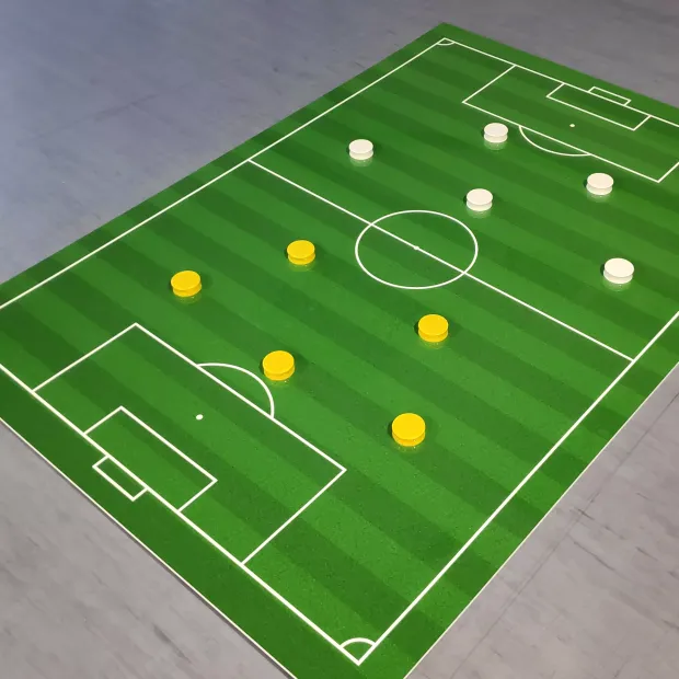 Magnetic dry-erase tactical football board 322 - Green surface with white graphics.