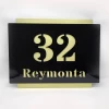 Engraved address plaque in dibond, 42 x 35 cm, black and gold - graphic design with black numbers and text on gold background.