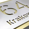 Engraved address plaque in dibond, 42 x 35 cm, silver-gold design with cut-out numbers and letters in silver material.