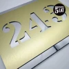 Engraved dibond number plaque 42 x 35 cm in brushed gold-silver with gold cut-out digits.