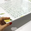 A4 whiteboard with a graphic design featuring a letter grid and lemon elements.