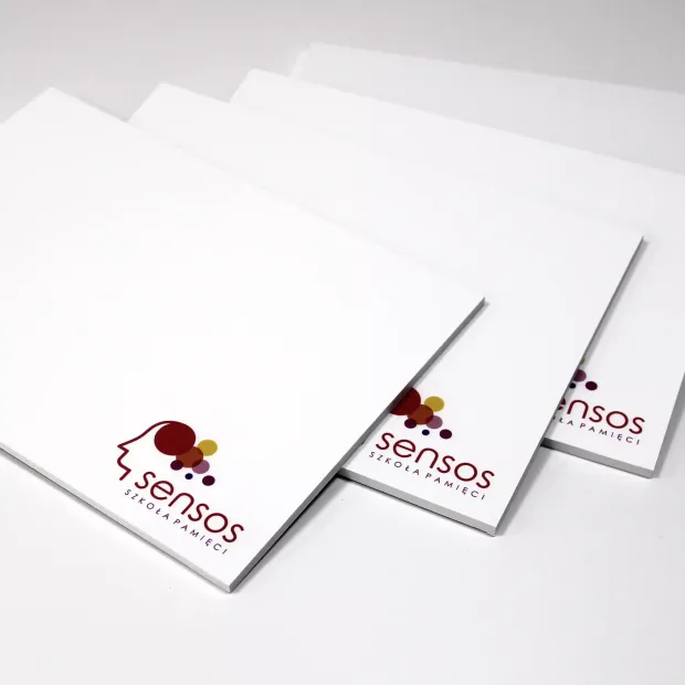 A5 white dry-erase board with a graphic design featuring a burgundy and yellow logo.
