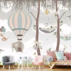 Children\'s wallpaper with trees, balloons, and animals 0532 DW - Brightly colored walls and furniture in a kids\' room.