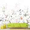 Branch and bird wallpaper 0519 DW - Living room decor with light walls, green sofa, and round yellow accents.