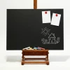 Magnetic chalkboard in an elegant wooden frame, perfect for creative arrangements in a room.