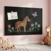 Magnetic chalkboard in a colorful kids\' room, perfect for creative drawings and play.