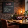 Custom chalkboard - Restaurant decor with dark brick walls and red leather seating.