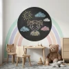 Round chalkboard in a child\'s room with pastel walls and a rainbow theme.