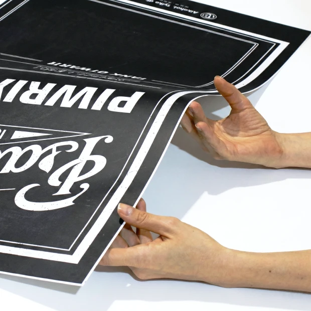 Custom chalkboard with graphic design. Black print with white letters and rectangular frames.