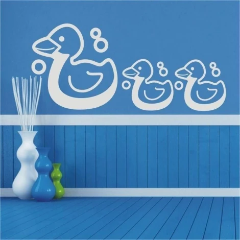 Duck sticker 1364 in a cheerful children\'s room against a blue wall, adds charm and freshness.
