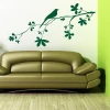 Elegant bird branch sticker 1344 in green, adding freshness to a modern living room.