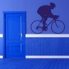 Stylish cyclist sticker in a vibrant blue shade, perfect for a modern sports room.