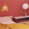 Colorful elephant motif wall sticker for a cheerful touch in a child\'s bedroom.