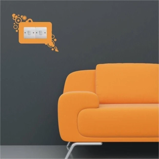 Colorful outlet sticker 1107 in a modern living room with an orange sofa, adding energy and style.