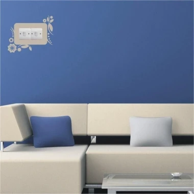Stylish wall sticker for outlet 1116 in a modern living room, adding charm and coziness to the blue decor.