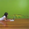 Charming crocodile sticker in vibrant colors, perfect for a cozy children\'s room, adding cheer.