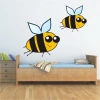 Charming yellow bee sticker with a cheerful expression, perfect for a child\'s room.