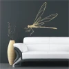 Elegant dragonfly sticker in a soft hue, perfect for a modern living room, adding a touch of lightness.