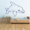 Stylish dolphin sticker in a minimalist children\'s room, adding lightness and joy to the space.