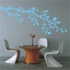 Delicate branch sticker 1441 in pastel blue, perfect for decorating a wall in a modern dining area.