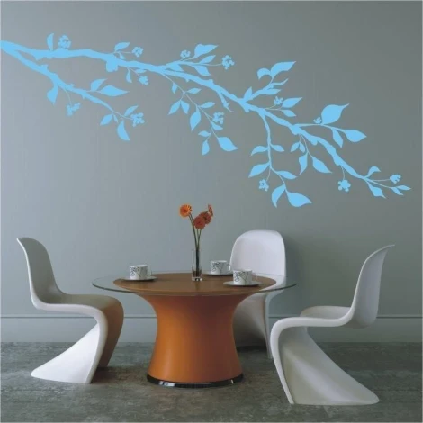 Delicate branch sticker 1441 in pastel blue, perfect for decorating a wall in a modern dining area.