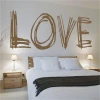 Stylish love sticker in a warm brown shade, perfect for a cozy bedroom, adding a romantic touch.