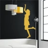 Women\'s silhouette in vibrant yellow, set in a modern living room, adding lightness and joy.
