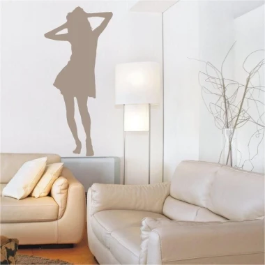 Dancing woman in subtle bronze tones, perfectly fitting into a modern living room, adds a touch of elegance.