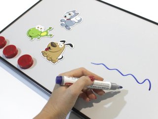 How does a magnetic whiteboard over a desk improve the working experience? 