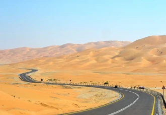 Wallpaper A Road Leading Through The Desert Fp 3422